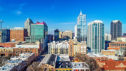 Downtown Raleigh skyline with modern high-rise buildings under a clear blue sky