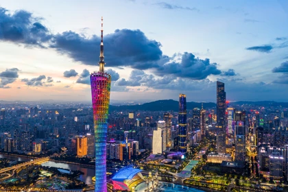 Guangzhou skyline at dusk featuring the illuminated Canton Tower and modern skyscrapers