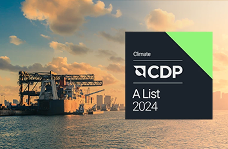 CDP Climate A List 2024 badge overlaid on a port scene at sunset, highlighting sustainability in logistics