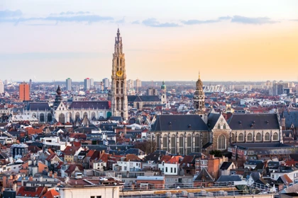 Skyline of Antwerp, Belgium, featuring the Cathedral of Our Lady and historic architecture at sunset