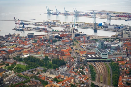 Panoramic view of Aarhus, Denmark, showing the city center, industrial harbor, and shipping cranes by the waterfront