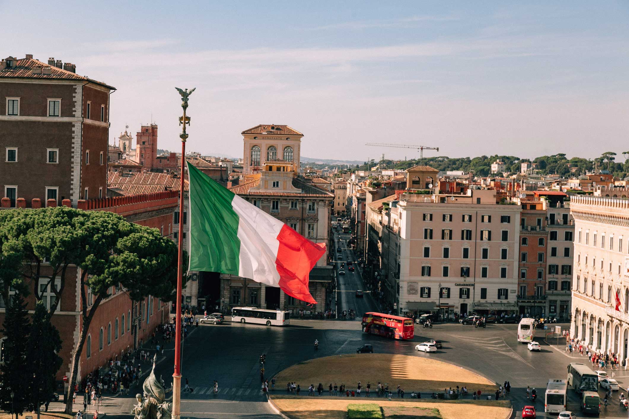 rome-piazza-venezia-italian-flag-cityscape