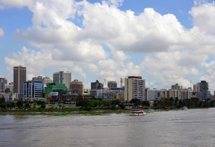 Skyline of Abidjan, Ivory Coast, featuring modern high-rise buildings along the lagoon