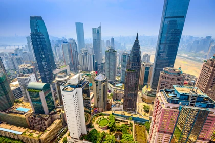 Chongqing skyline with modern skyscrapers and green urban spaces under a clear sky