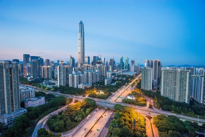 Shenzhen skyline at dusk featuring the Ping An Finance Centre and illuminated highways