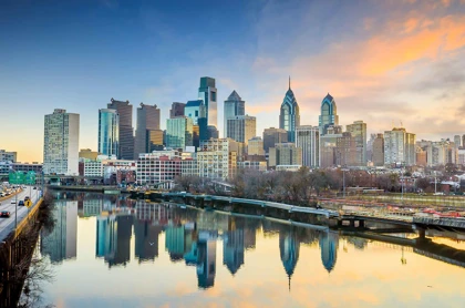 Philadelphia skyline at sunset, reflecting on the Schuylkill River